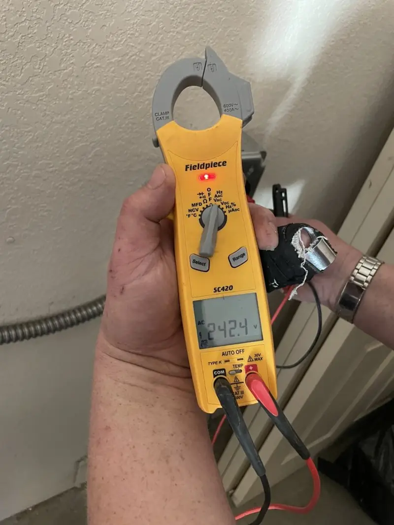 Voltage testing with clamp meter during Aluminum Wiring Replacement in Welsh